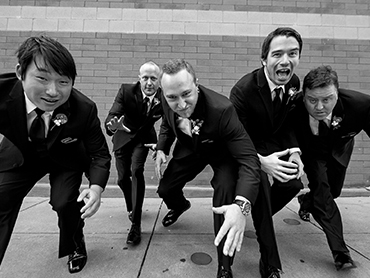 Aaron and his groomsmen have fun during their wedding day photography session.