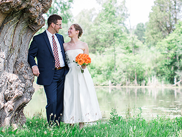 Ashley & Josh cuddle by an old tree at the Matthaei Botanical Gardens in Ann Arbor