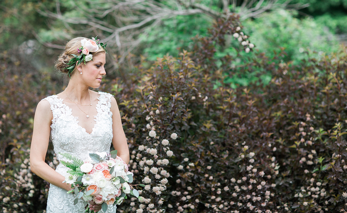 Maureen poses outdoors with her beautiful bouquet before her Farmington Hills, Wedding.